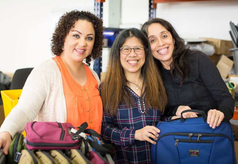 Andrea, Velia, and Lulu near the Quality Control department.
